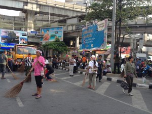 Protesters sweeping the street 