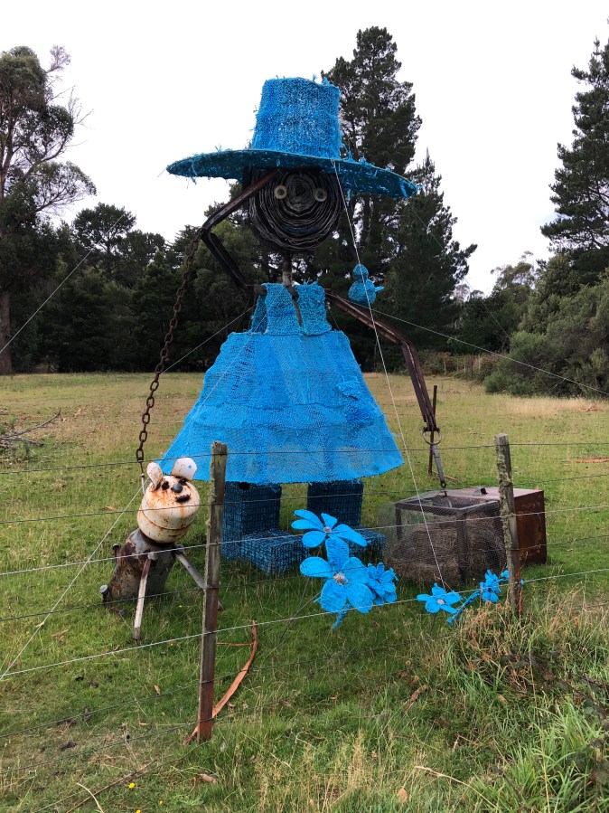 Female farmer sculpture in blue dress