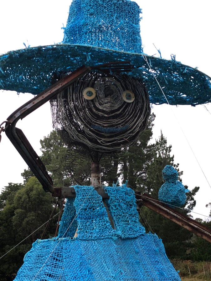 Sire sculpture of female farmer with blue hat